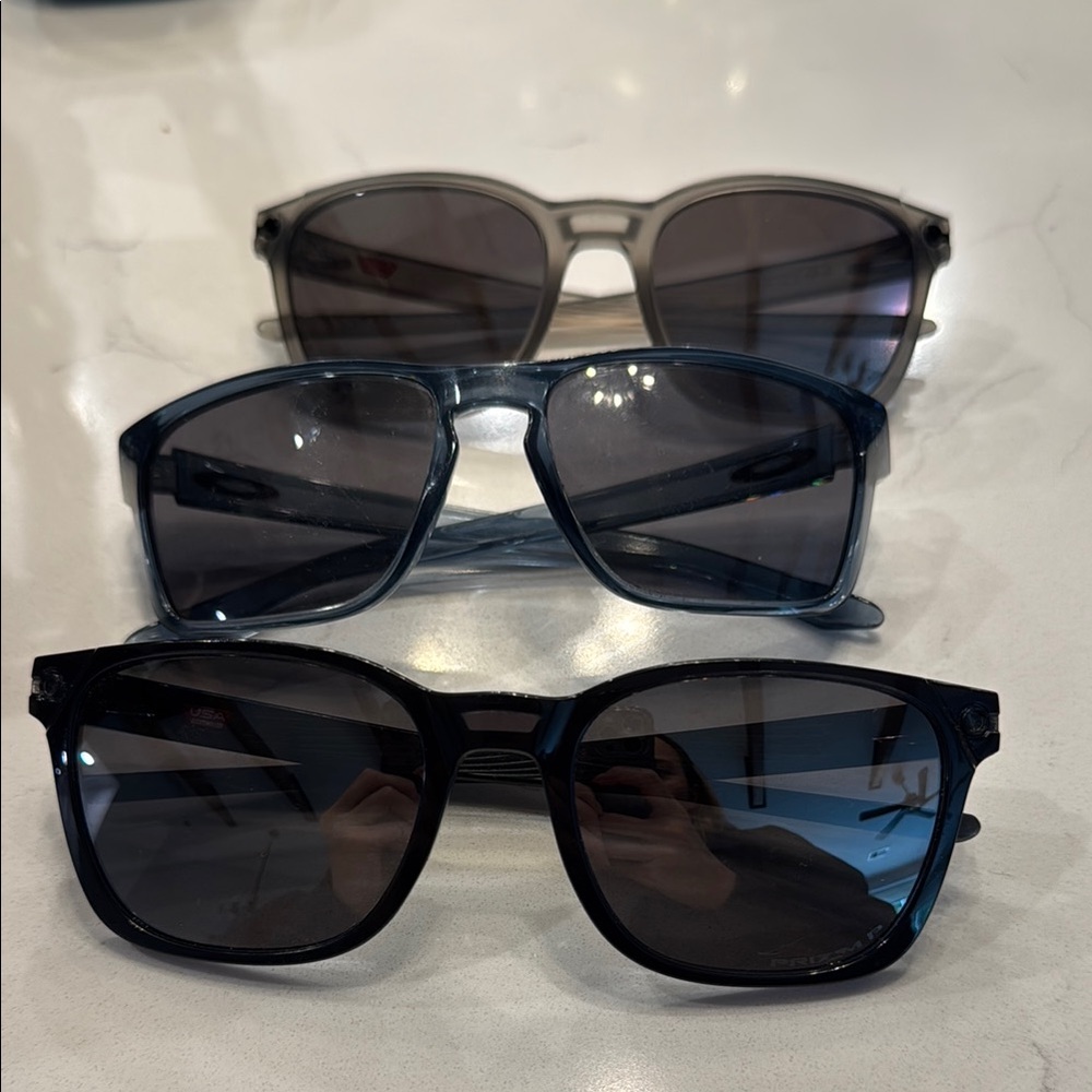Oakley men Sunglasses Trio in Black, Blue, and Gray
